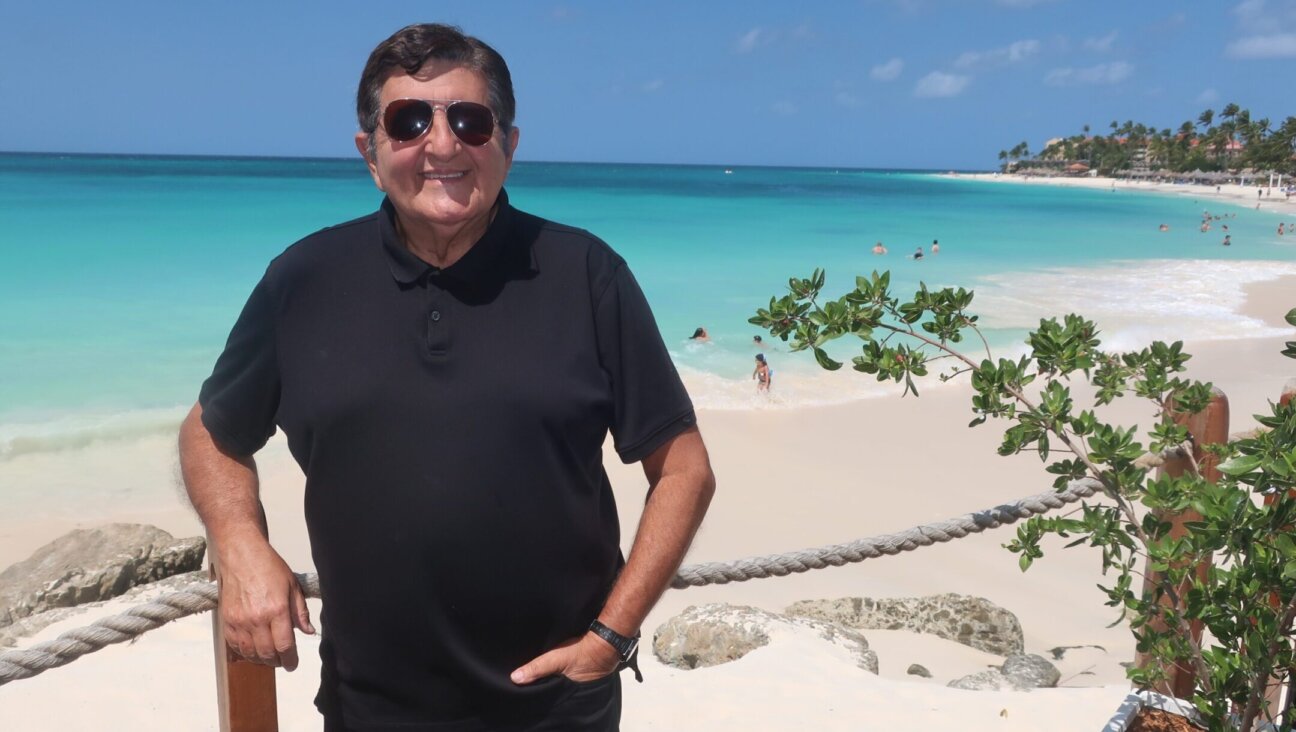 Rabbi Alberto (Baruch) Zeilicovich, seen at Eagle Beach in Aruba, recently came out of retirement to bec0me the spiritual leader of Temple Beth Israel on the southern Caribbean island. (Dan Fellner)