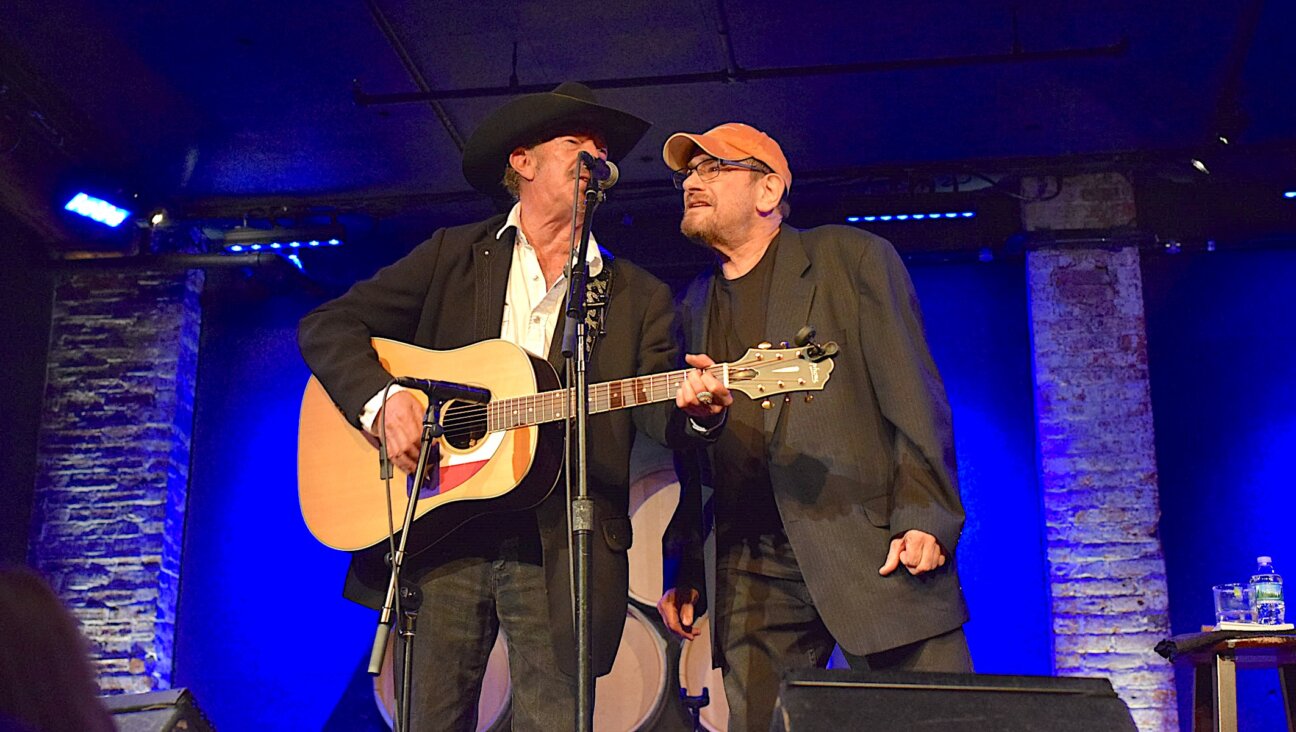 Nathan “Chinga” Chavin, right, and Kinky Friedman perform together in an undated photo. The two were frat brothers at the University of Texas. (Courtesy Brandi Chavin)