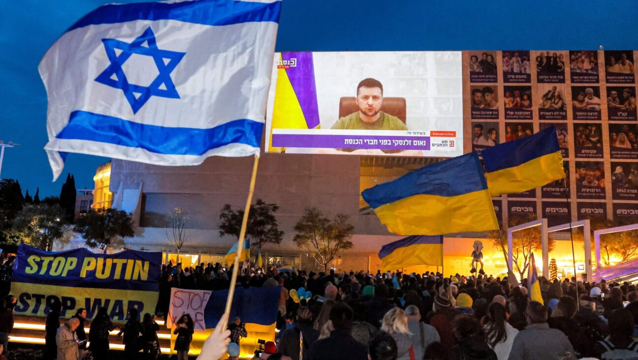 Demonstrators gather at Habima Square in the centre of Israel's Mediterranean coastal city of Tel Aviv on March 20, 2022 to attend a televised video address by Ukraine's President Volodymyr Zelenskyy to the Israeli Knesset. 