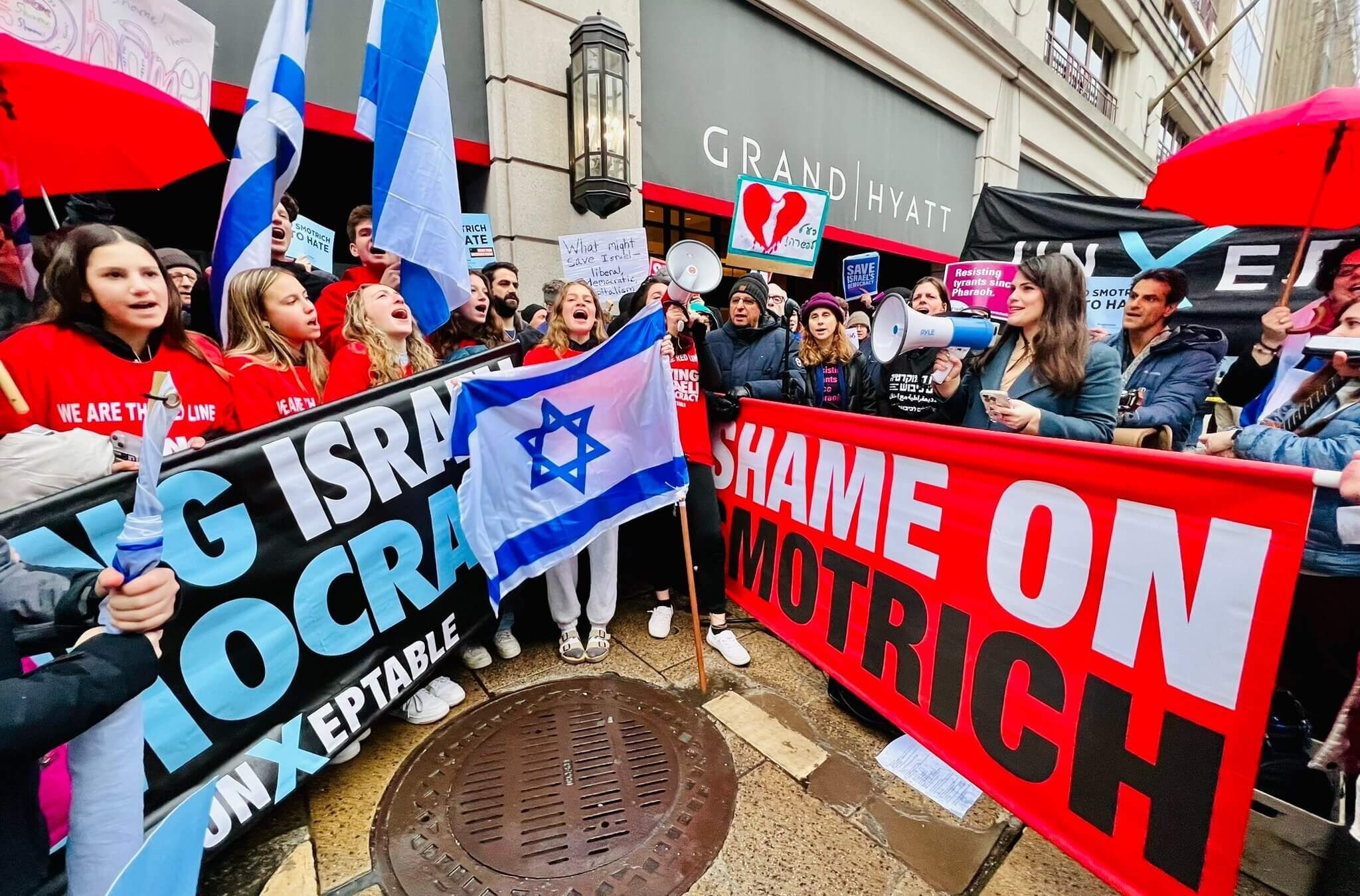 Sheila Katz, chief executive of the National Council of Jewish Women, addresses several hundred protesters gathered outside the Washington, D.C., hotel where Bezalel Smotrich, the far-right Israeli finance minister, was speaking to an Israel Bonds conference.