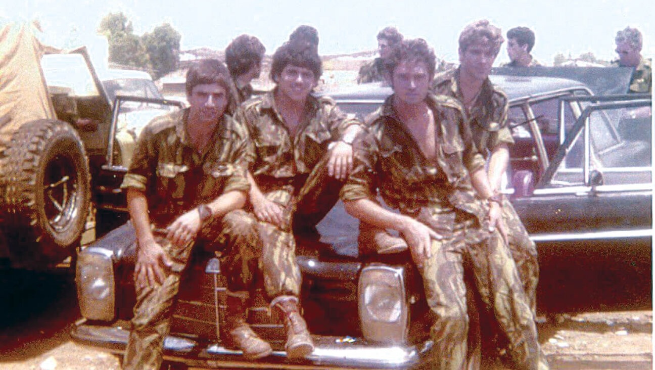 Team Amnon, back in Israel from the Entebbe hostage rescue operation, pose on a black Mercedes car that was a crucial part of the rescue operation,  July 4, 1976. 