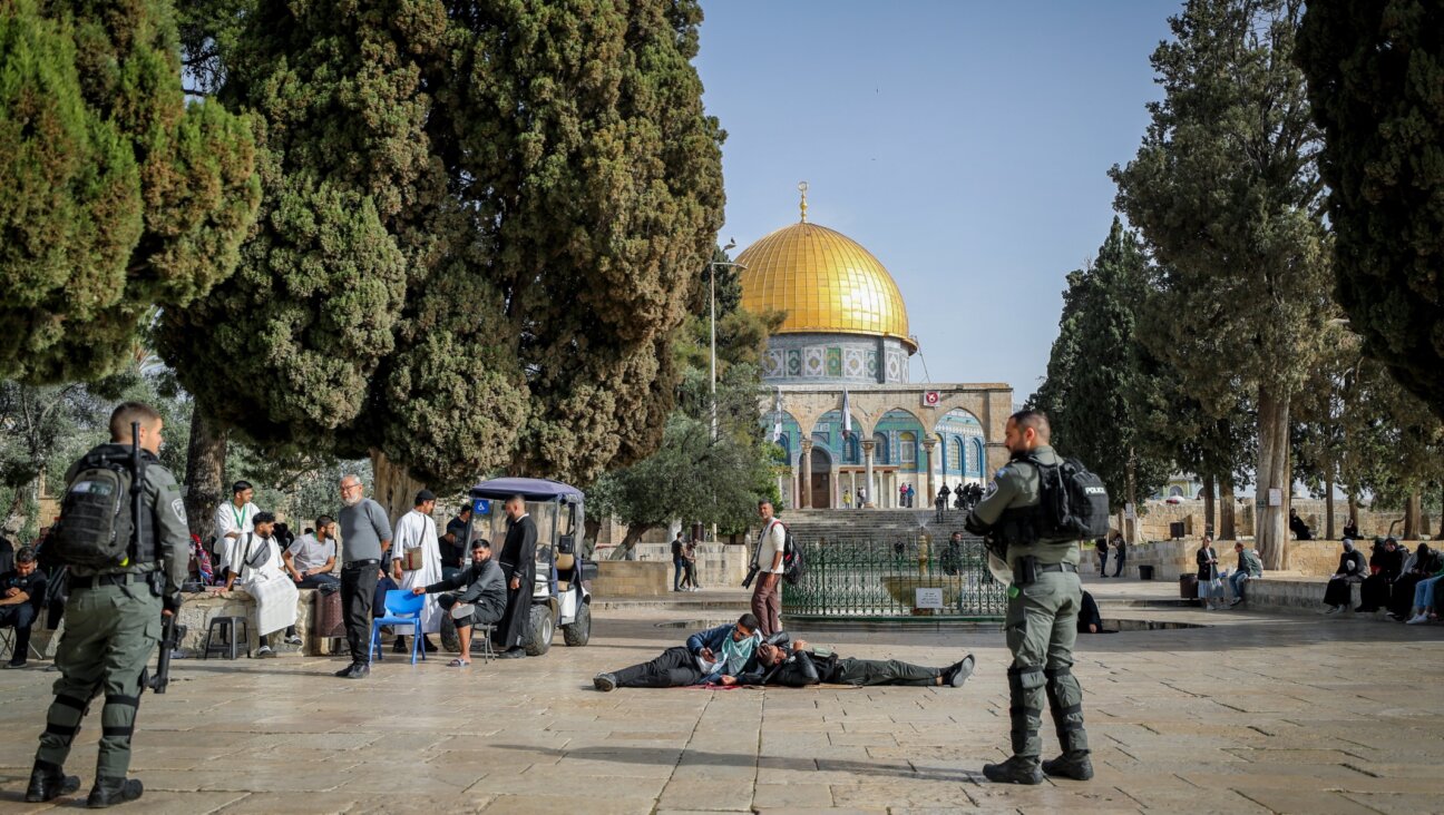 Israeli security forces guard while Jews visit the Temple Mount, in Jerusalem’s Old City, during the Passover holiday the holy month of Ramadan, April 9, 2023. (Jamal Awad/Flash90)