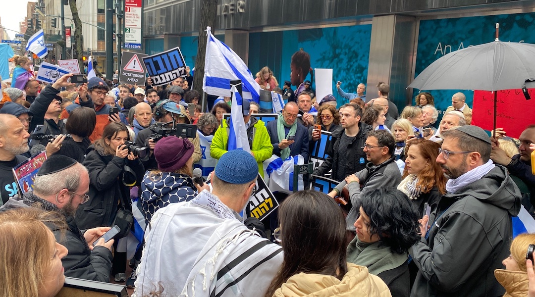 Rabbi Jill Jacobs, with microphone, speaks at a rally for Israeli democracy by Israelis and American Jews outside Israel’s consulate in Manhattan, March 27, 2023. (T’ruah, via Twitter)