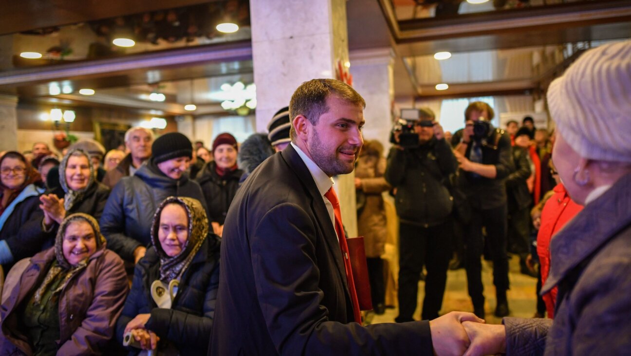 Ilan Shor, then mayor of the town of Orhei, Moldova, meets with supporters during a campaign event in the city of Comrat, Feb. 15, 2019. (Daniel Mihailescu/AFP via Getty Images)