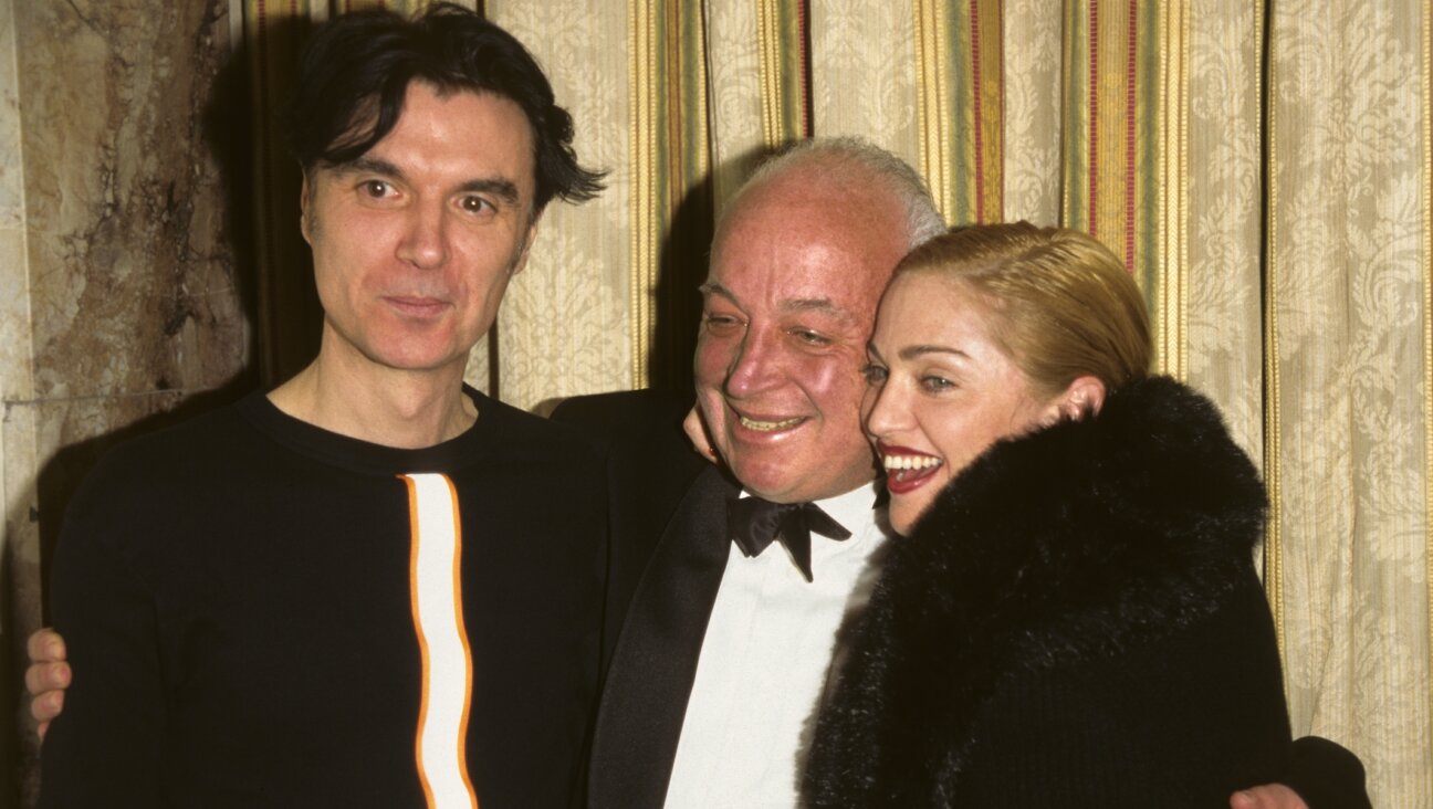 Seymour Stein with David Byrne and Madonna in 1996. (KMazur/WireImage/Getty Images)