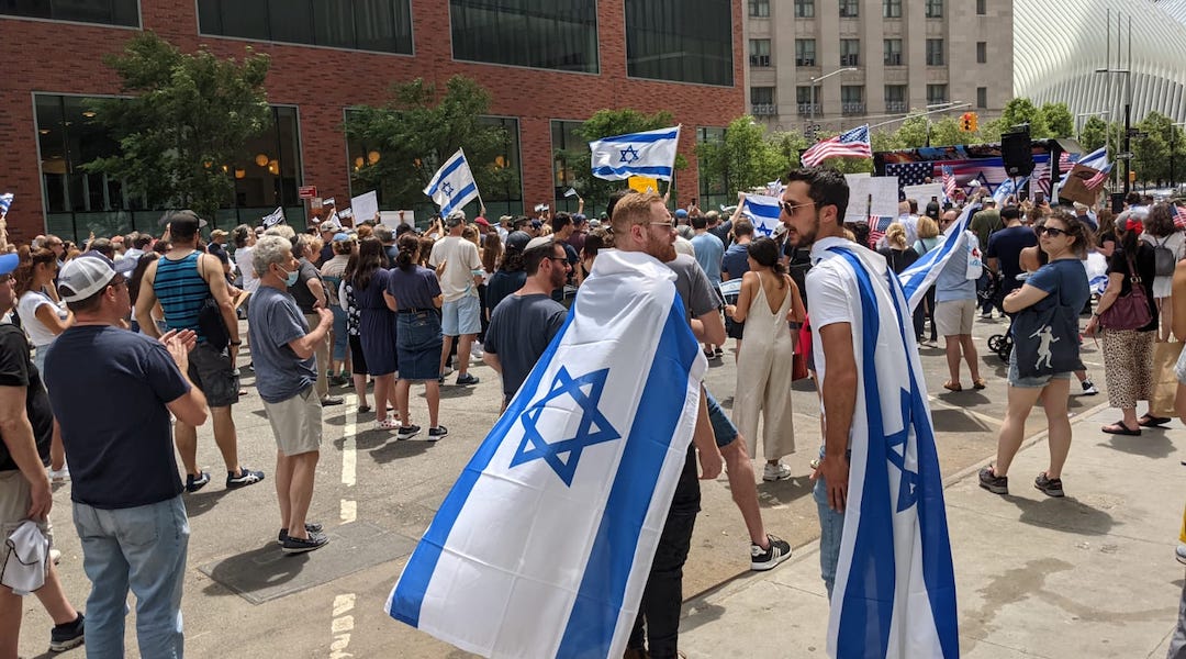 Two men wearing Israeli flags in New York City on May 23, 2021. (Ben Sales)