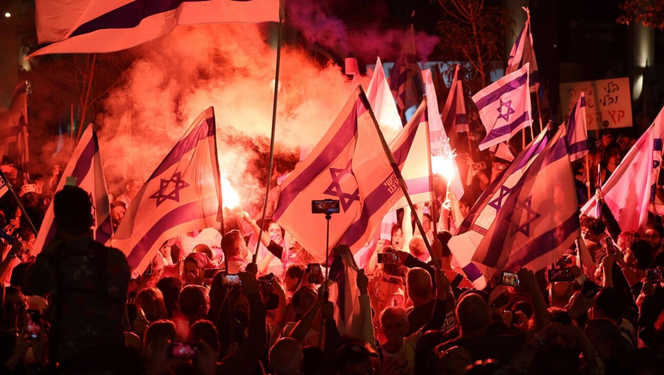 Demonstrators at a rally in Tel Aviv protest the Israeli government's proposed judicial overhaul bill as the country celebrates its independence day.