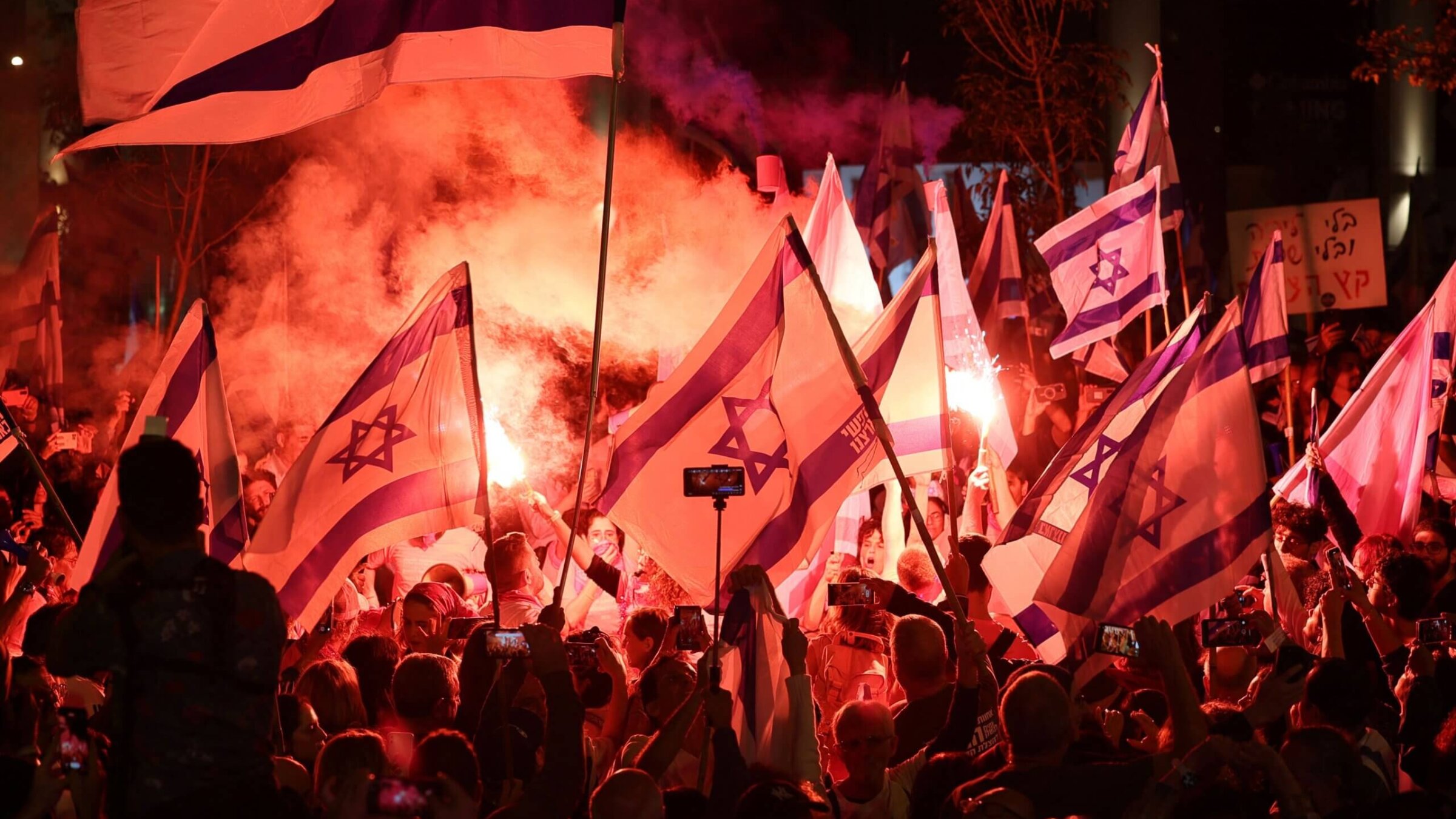 Demonstrators at a rally in Tel Aviv protest the Israeli government's proposed judicial overhaul bill as the country celebrates its independence day.