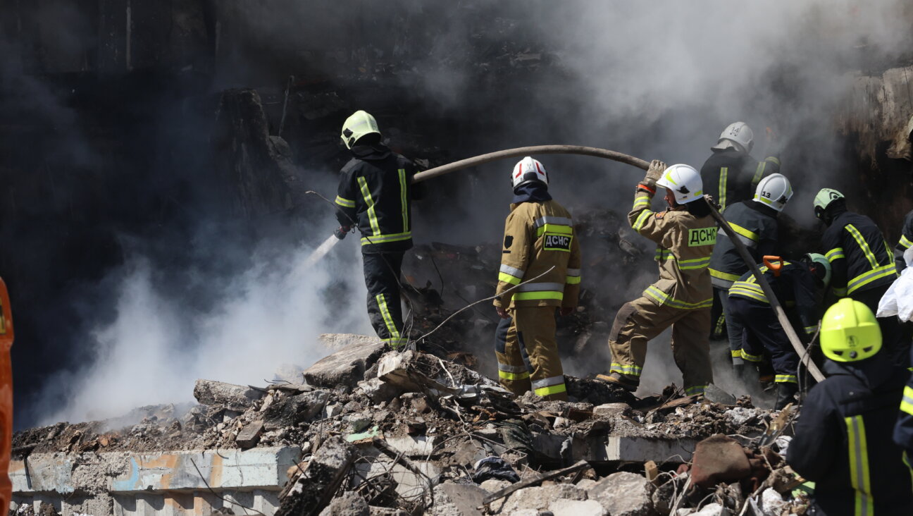 Firefighters extinguish a fire at destroyed residential building on April 28, 2023, in Uman, Ukraine. During the night, Russia carried out a massive missile attack on the entire territory of Ukraine.