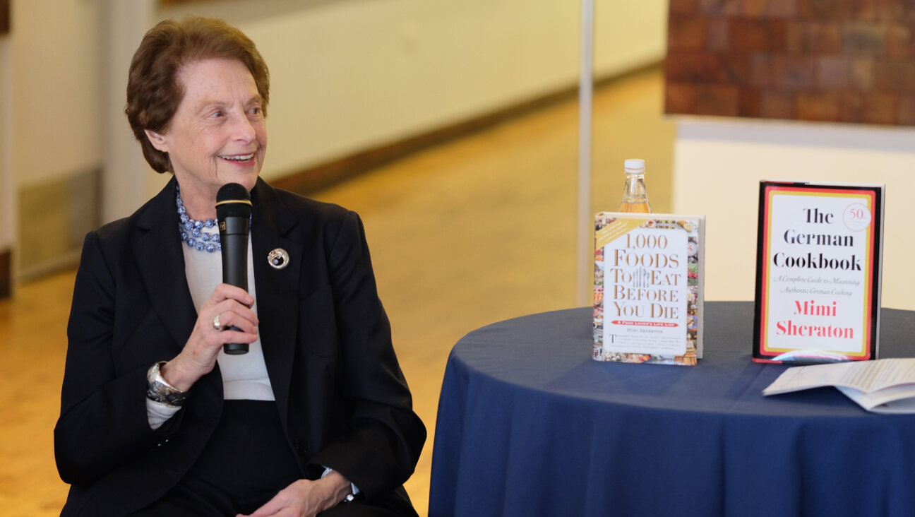 Mimi Sheraton with two of her books on display in 2016 in New York.