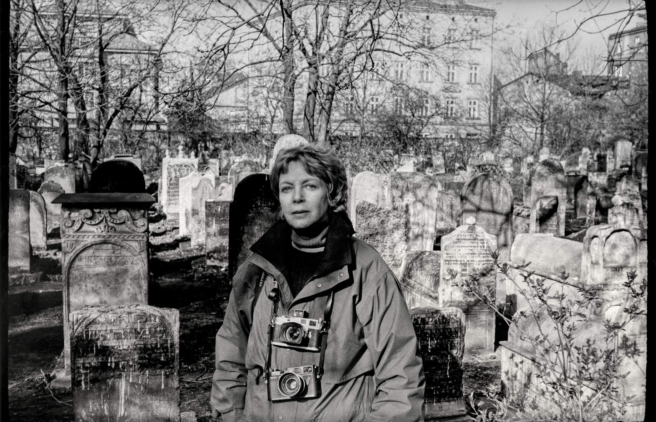 Jill Freedman in a Jewish cemetery in Poland.