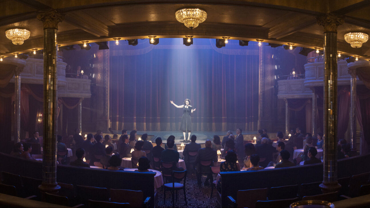 Midge Maisel performing — not in the industrial musical, of which there are no stills. You'll just have to watch the episode.