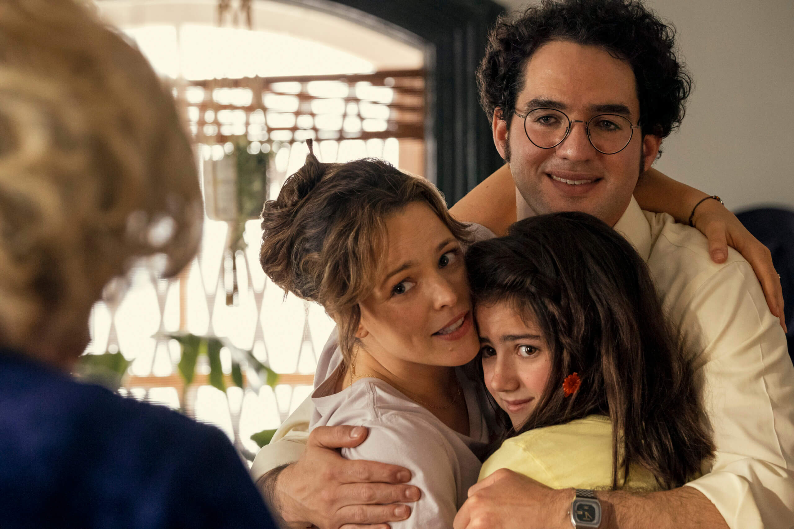 A photo of a Barbara Simon (played by Rachel McAdams) and Herb Simon (Benny Safdie) embracing their daughter Margaret.