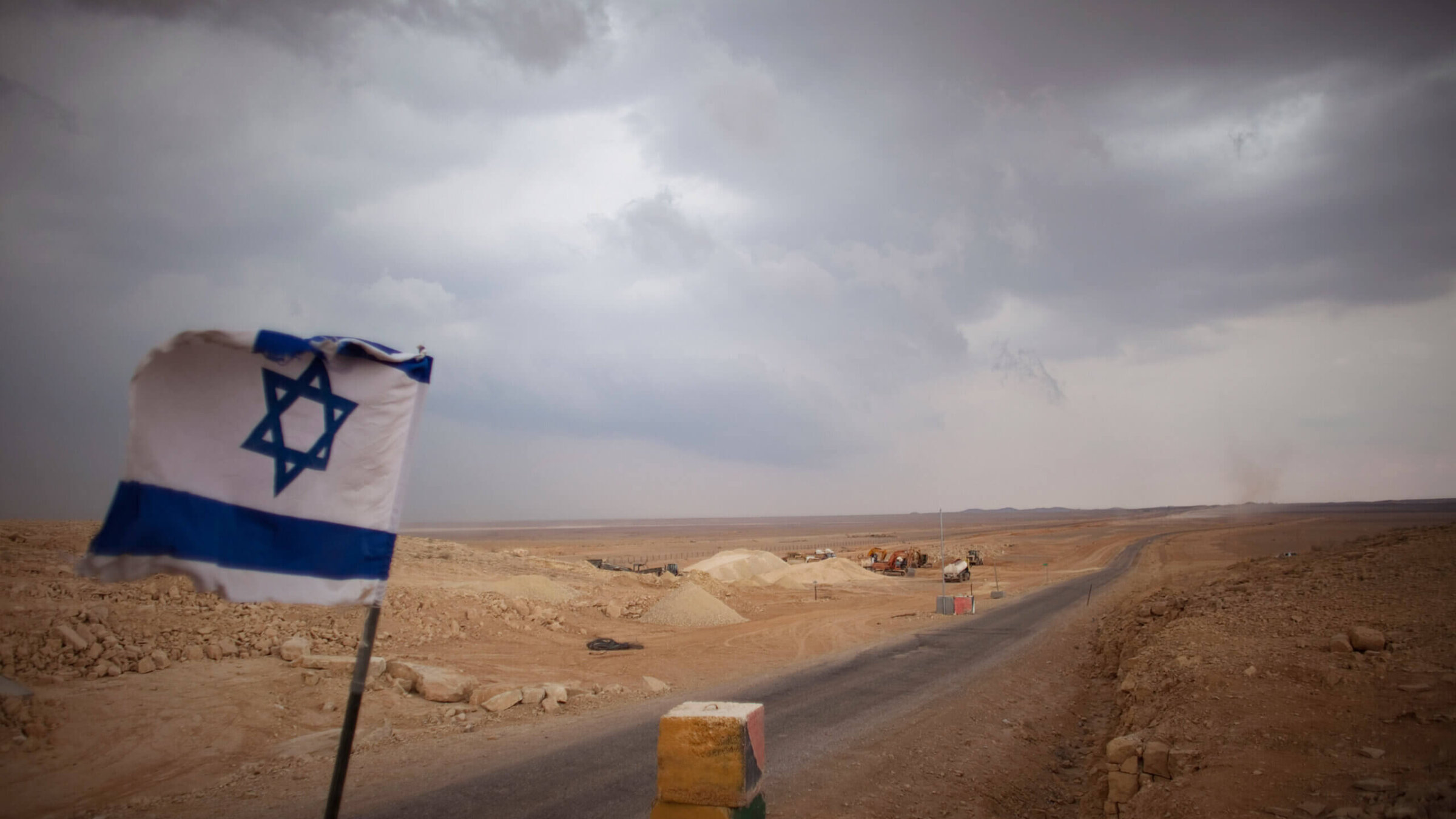 An Israeli flag flies at a checkpoint at the Israeli Egyptian border on February 10, 2011 in Israel. 