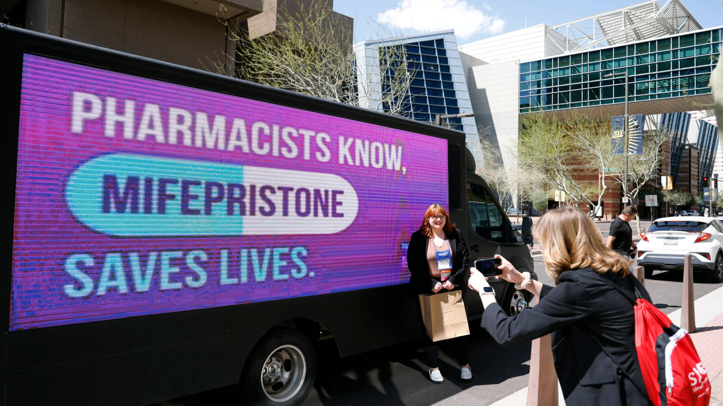 Abortion activists are seen at the American Pharmacists Association Annual Conference at the Phoenix Convention Center on March 25, 2023 in Phoenix, Arizona. Advocacy group UltraViolet are urging pharmacists to reaffirm that Mifepristone, a medication abortion drug, is safe, effective and essential. 