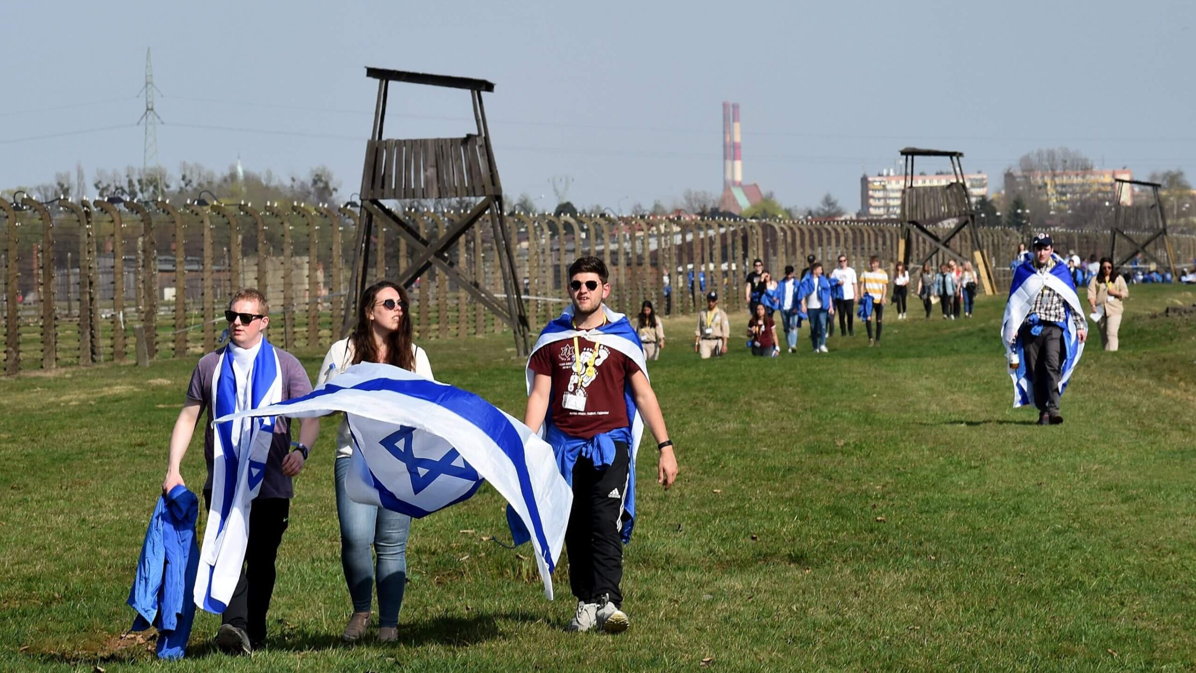 Youth hold Israeli flags during the "March of the Living", a yearly Holocaust remembrance march between the former death camps of Auschwitz and Birkenau, on April 12, 2018 in Oswiecim (Auschwitz), Poland. 
