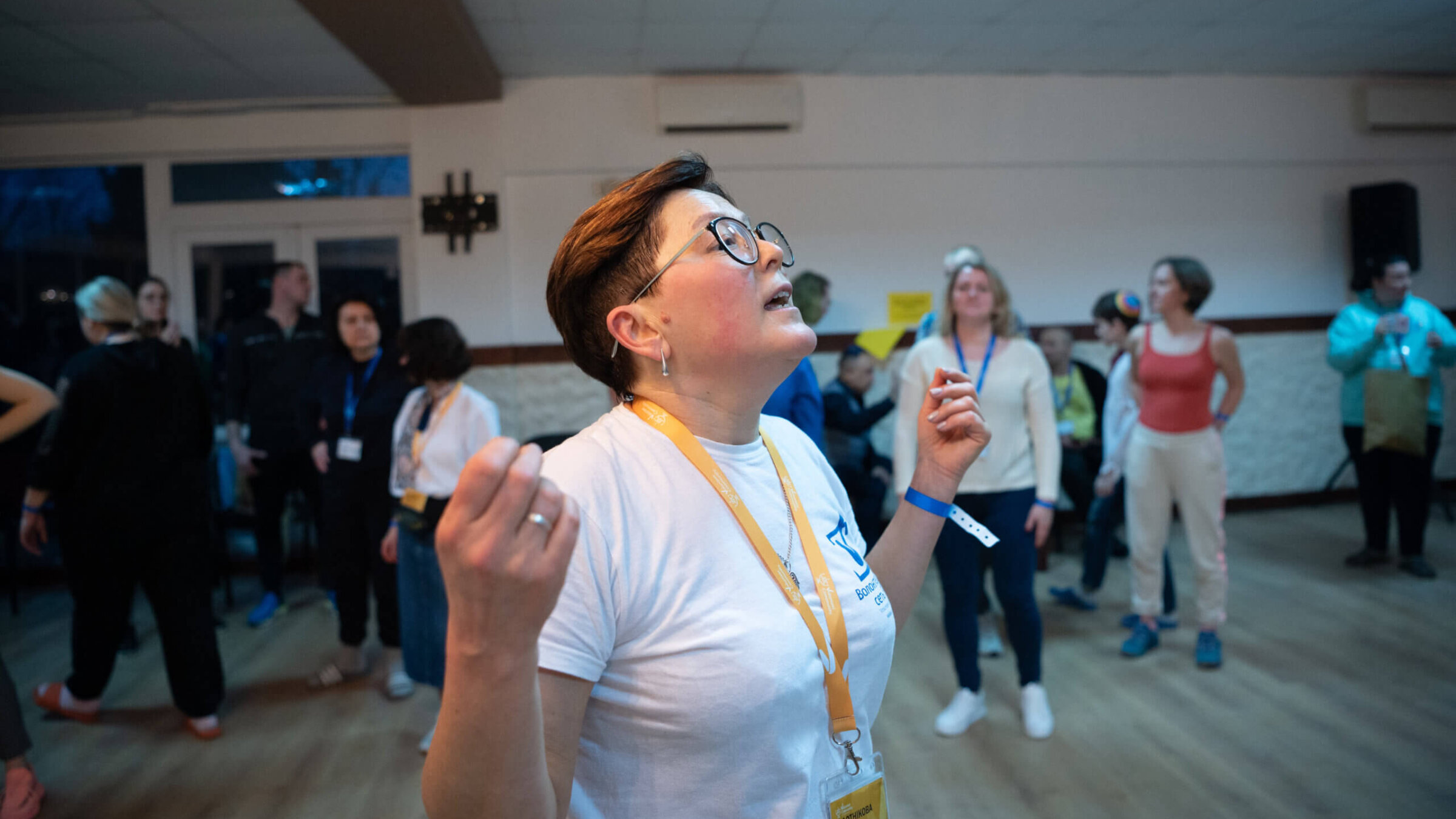 Tatiana Plotnikova, 54, leads a dance class for dozens of Ukrainian Jews at a JDC volunteer Shabbaton in Truskavets, Ukraine in February, 2023.