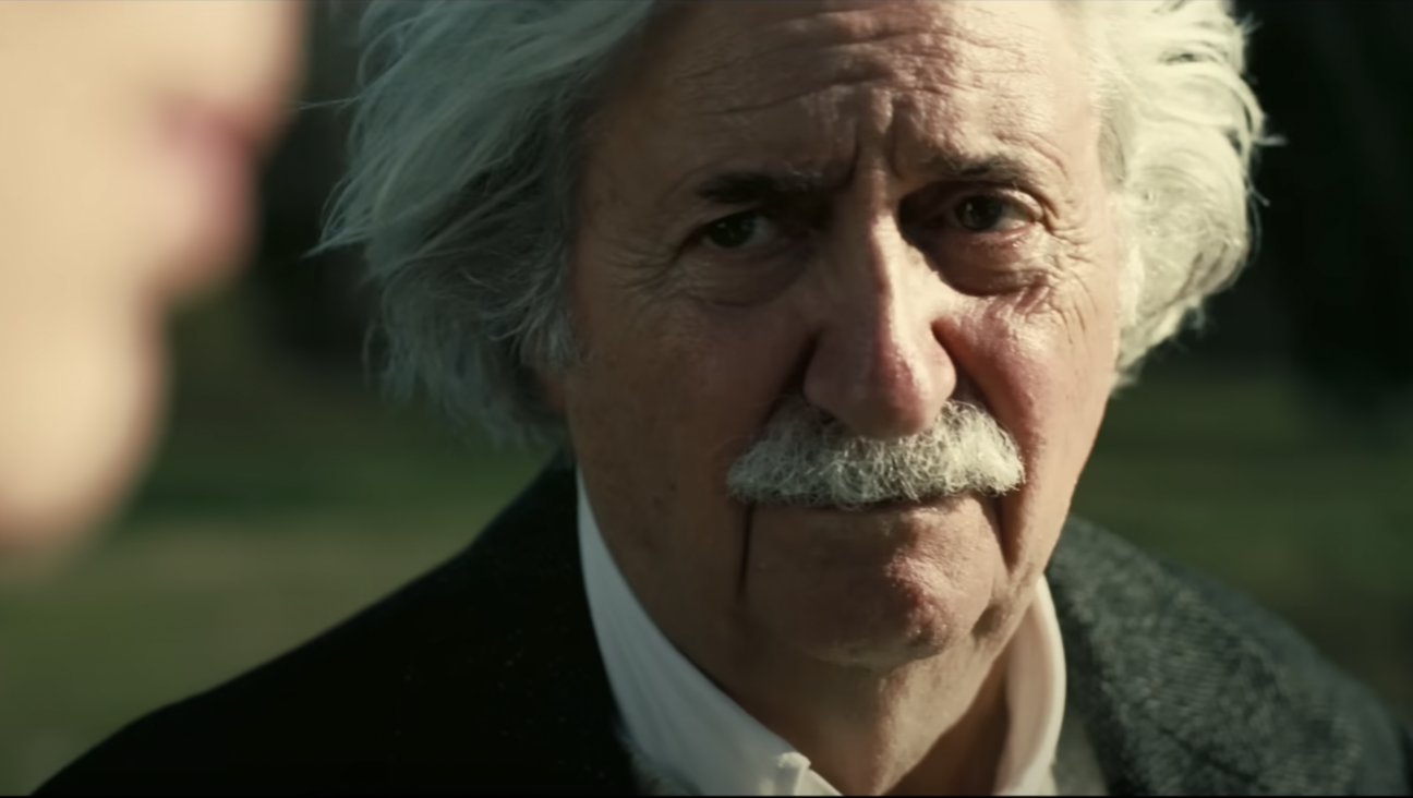 Albert Einstein (Tom Conti) in a scene from the trailer for the historical biopic “Oppenheimer,” about the creation of the atomic bomb. (Screenshot via Universal Pictures)