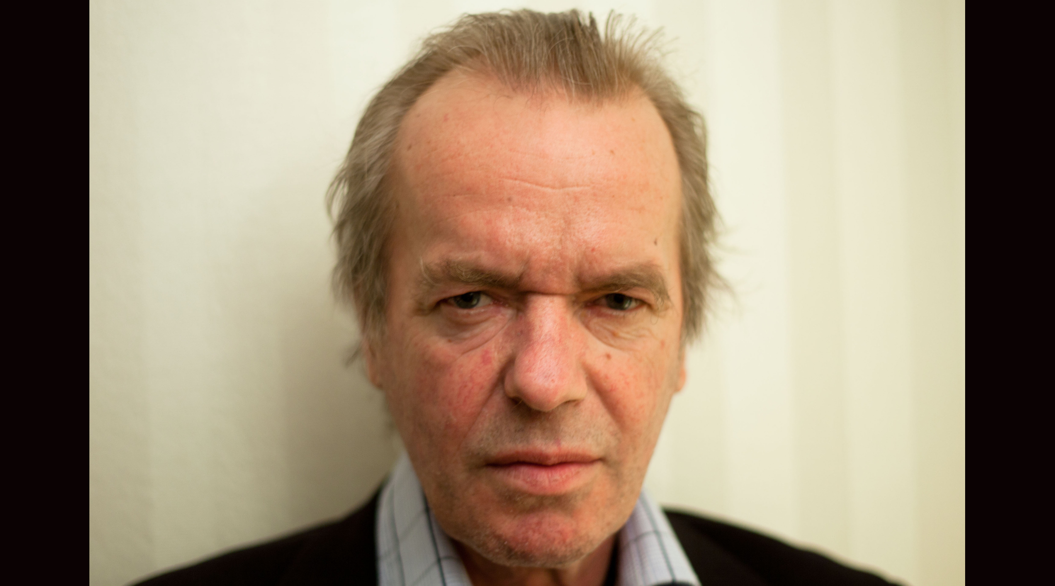 The English author Martin Amis, photographed by Maximilian Schönherr in a hotel suite in Cologne, Germany, March 17, 2012. (Maximilian Schönherr via Creative Commons)