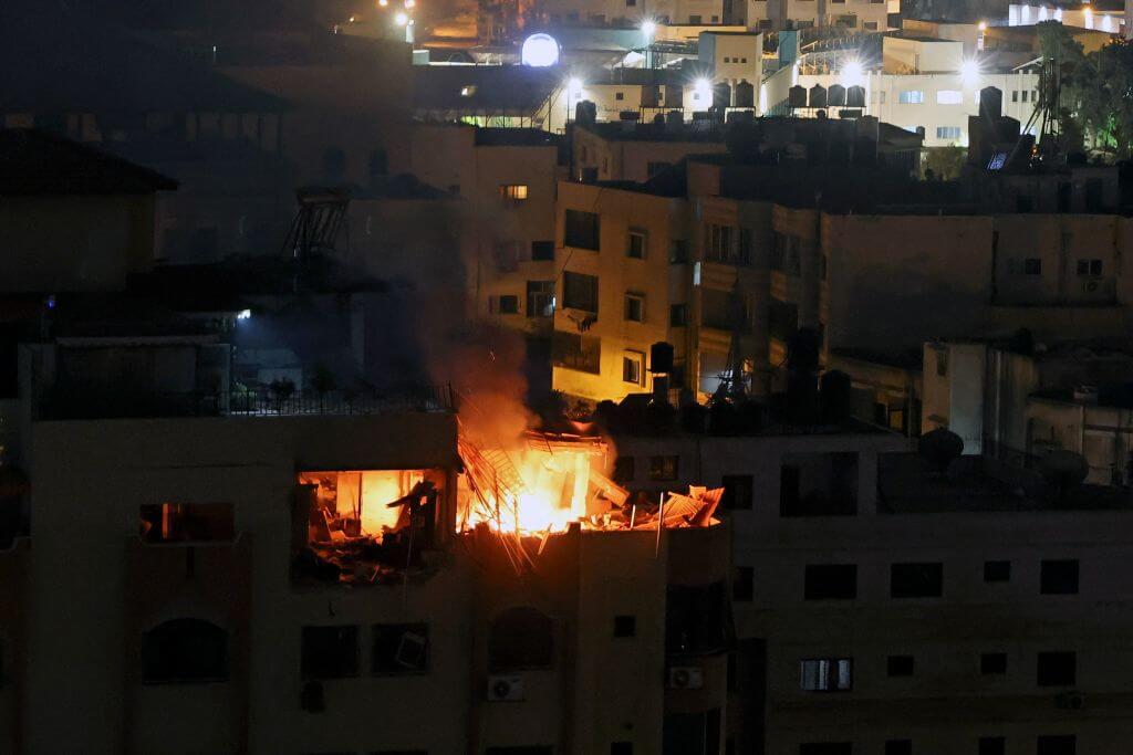 A fire breaks out at an apartment following an explosion in Gaza City, Palestinian Territories on May 9, 2023.  (Photo by MOHAMMED ABED/AFP via Getty Images)