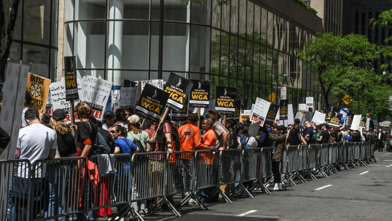 Writers Guild of America members and supporters picket NBCUniversal at Rockefeller Plaza.