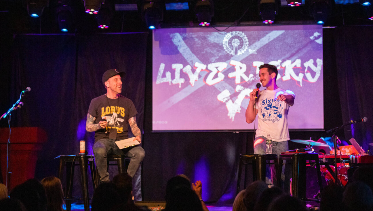 Spike Eskin, left, and Michael Levin at a live recording of the <i>Rights to Ricky Sanchez</i> podcast in April.