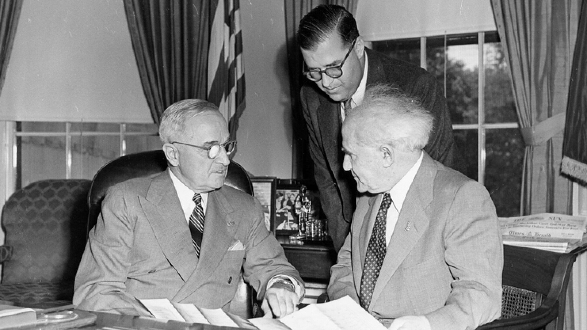 President Harry S Truman (left) meets with Israeli Prime Minister David Ben-Gurion (right) and the Ambassador of Israel to the United States, Abba Eban (standing) in a gift ceremony in the Oval Office on 
May 8, 1951. (Abbie Rowe/Harry S. Truman Library & Museum)