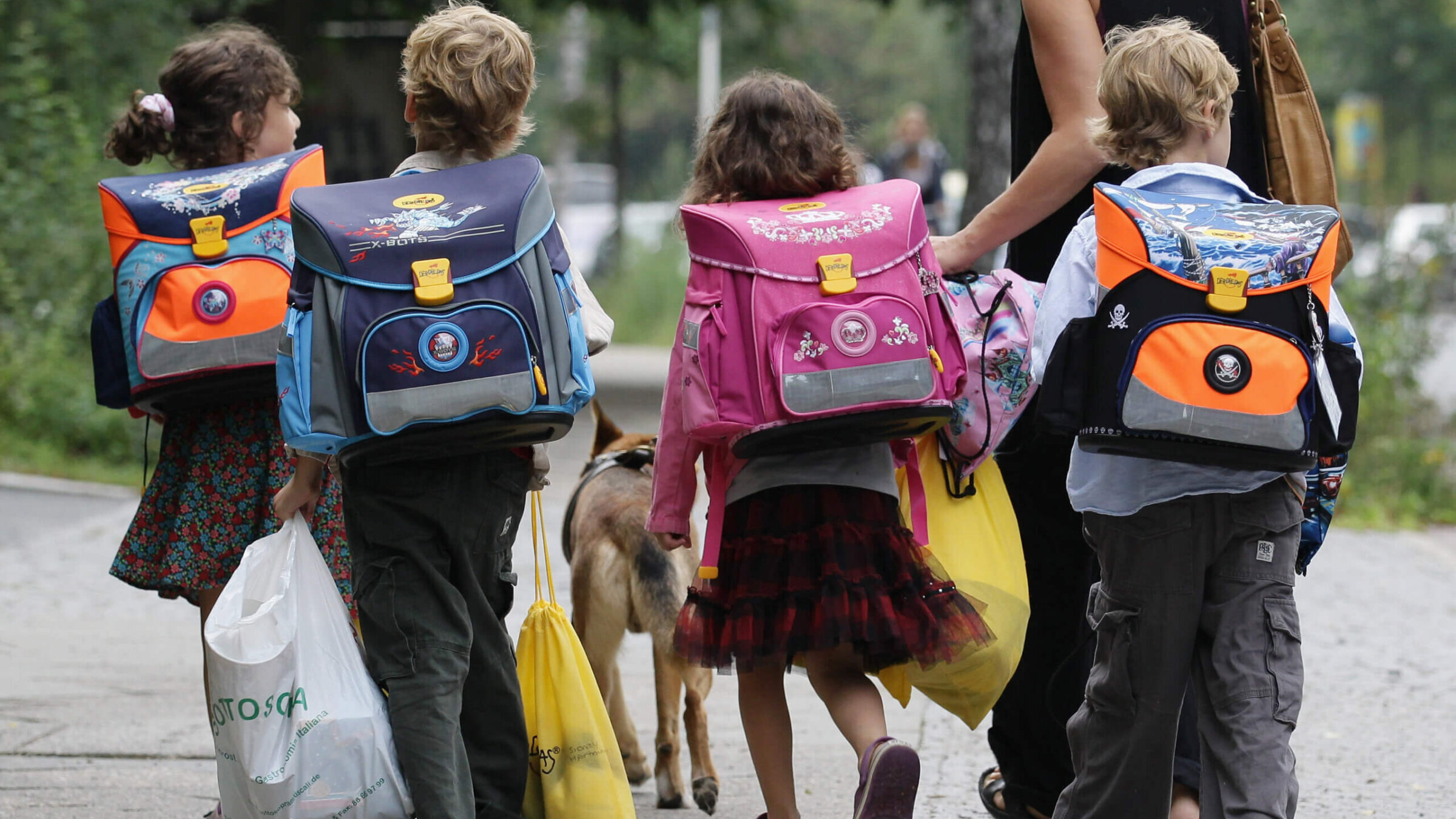 Children walk down the way on the first school day on August 23, 2010 in Berlin, Germany. 