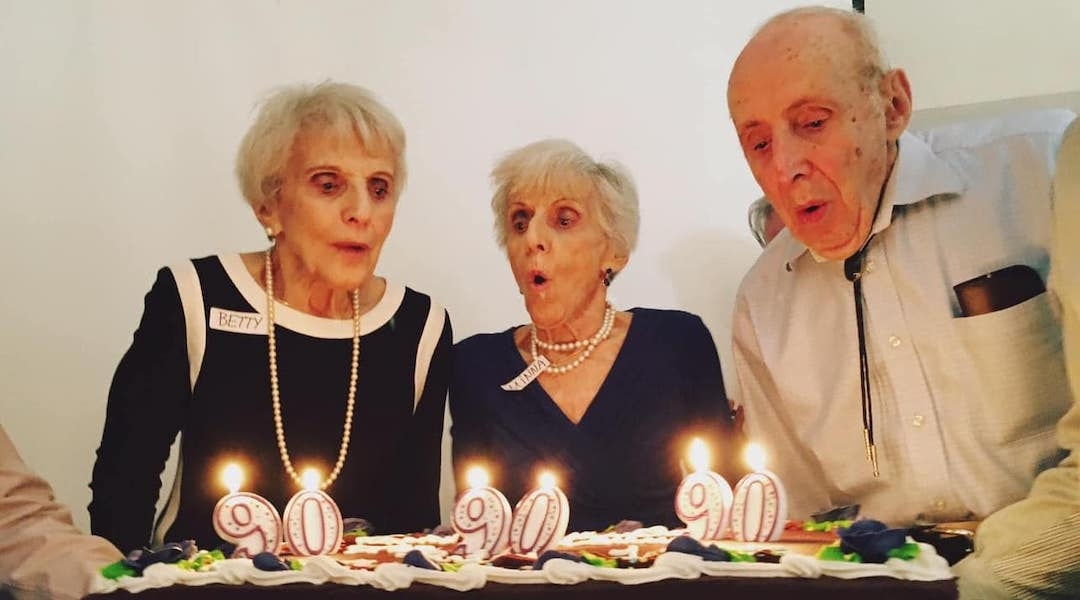 Betty Woolf, left, and her siblings Minna and Joseph celebrate their 90th birthday in 2017. (Courtesy Jason Paladino)