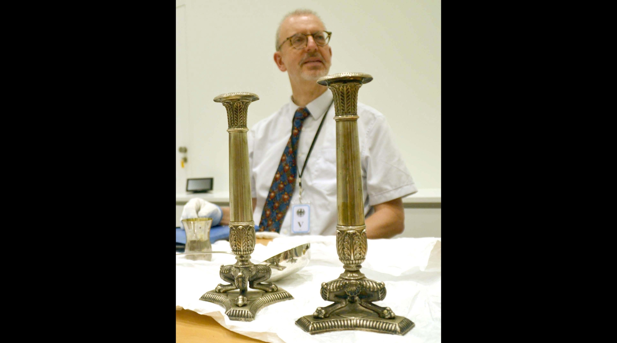 Matthias Weniger, head of provenance research at the Bavarian National Museum, shown with museum objects in Tel Aviv, June 5, 2023. (Christina Storz/dpa via Getty)