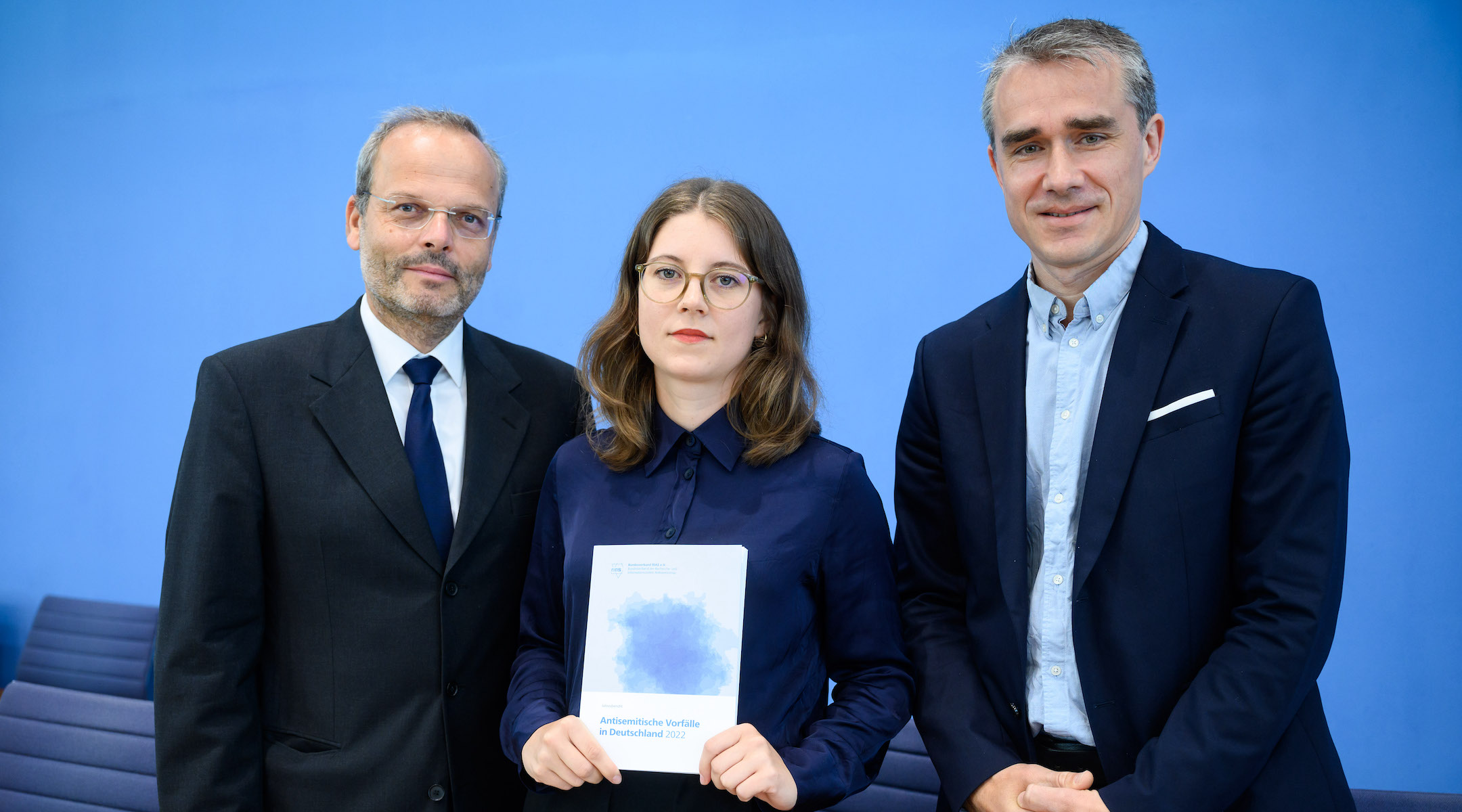 From left to right: Felix Klein, Germany’s antisemitism monitor; Bianca Loy, co-author of the RIAS report; and Benjamin Steinitz, executive director of RIAS, shown in Berlin with the organization’s 2022 antisemitism report, June 27, 2023. (Bernd von Jutrczenka/picture alliance via Getty Images)