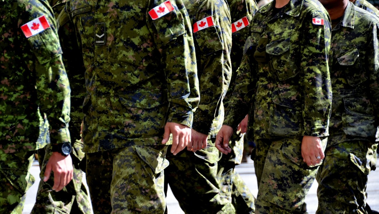 Canadian soldiers march in uniform. (Getty)