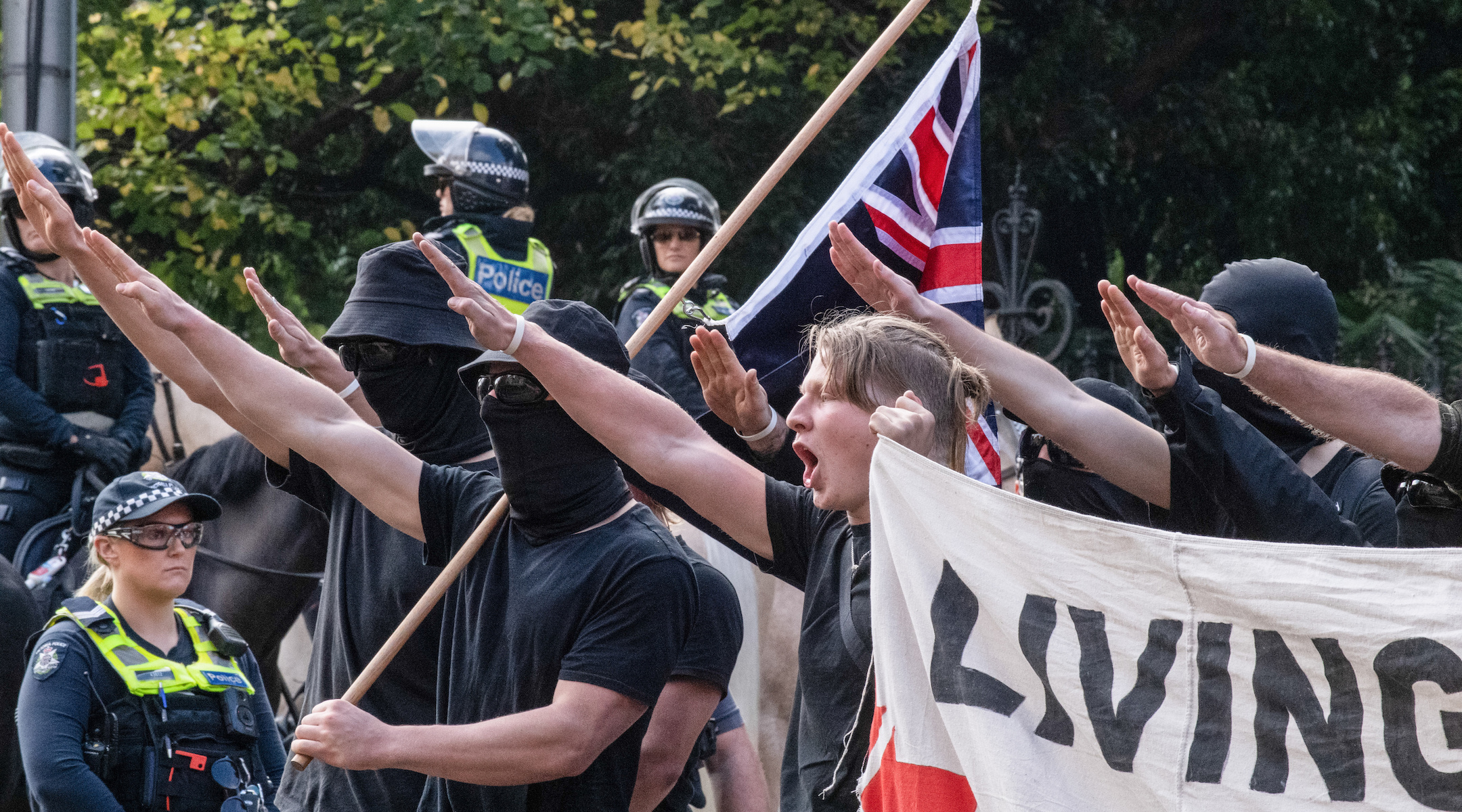 Neo-Nazi protesters make a Nazi salute at a protest in Melbourne, May 13, 2023. (Michael Currie/SOPA Images/LightRocket via Getty Images)