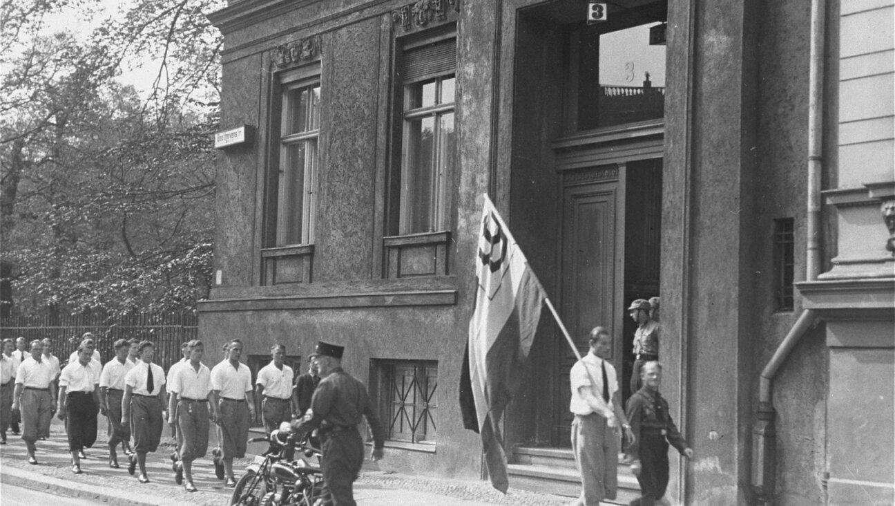 A Nazi student group parades in front of the Institute for Sexual Research shortly before occupying it on May 6, 1933.