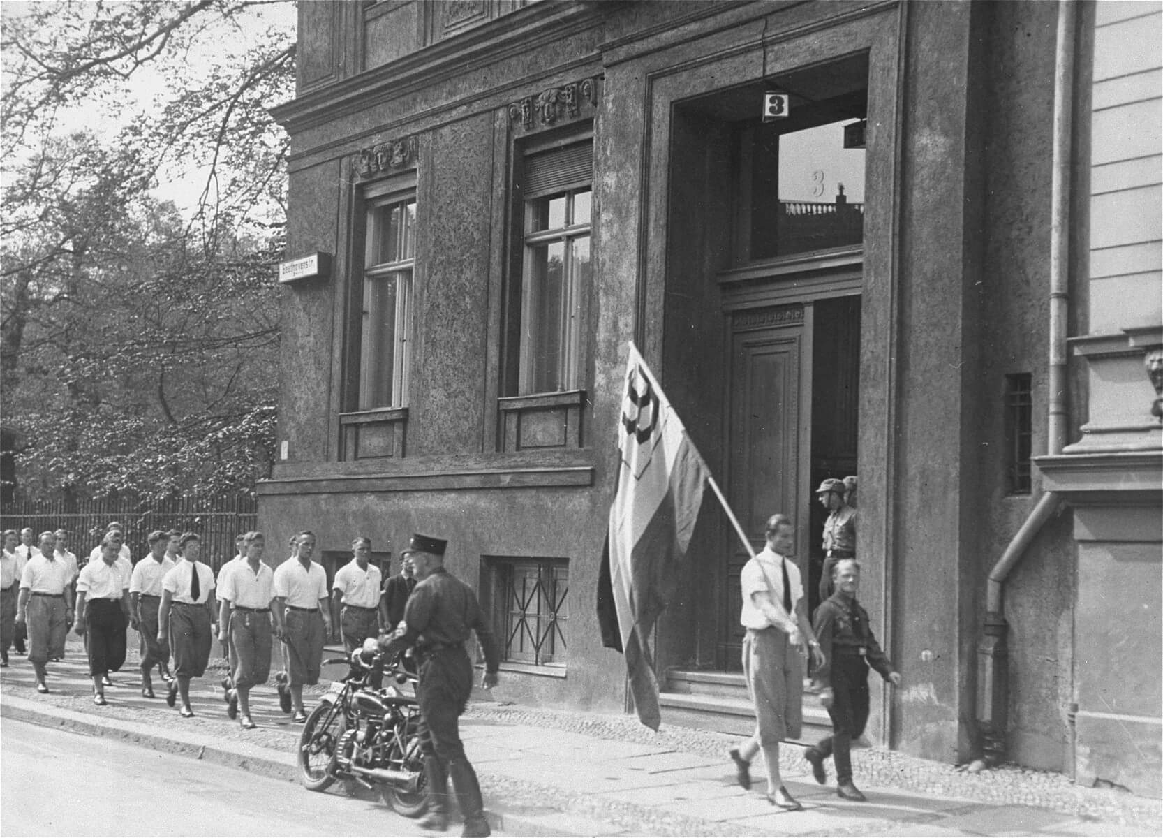 A Nazi student group parades in front of the Institute for Sexual Research shortly before occupying it on May 6, 1933.