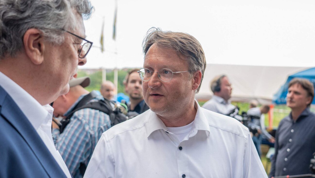 Robert Sesselmann, in white, attends an AfD election event in Sonneberg, eastern Germany, June 25, 2023. (Ferdinand Merzbach/News5/AFP via Getty Images)