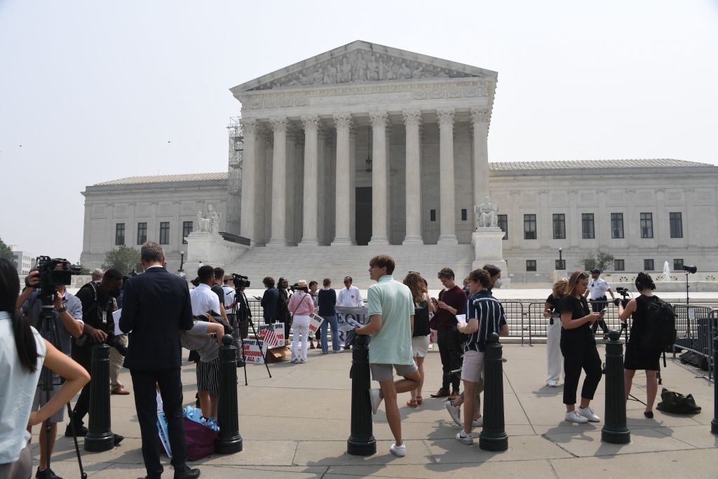 A crowd gathered outside the Supreme Court on Thursday. (Getty)