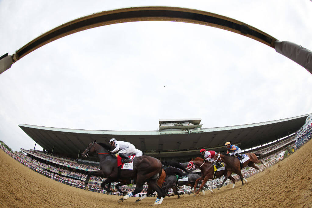 The field runs out of the starting gate during 154th running of the Belmont Stakes at Belmont Park in 2022.