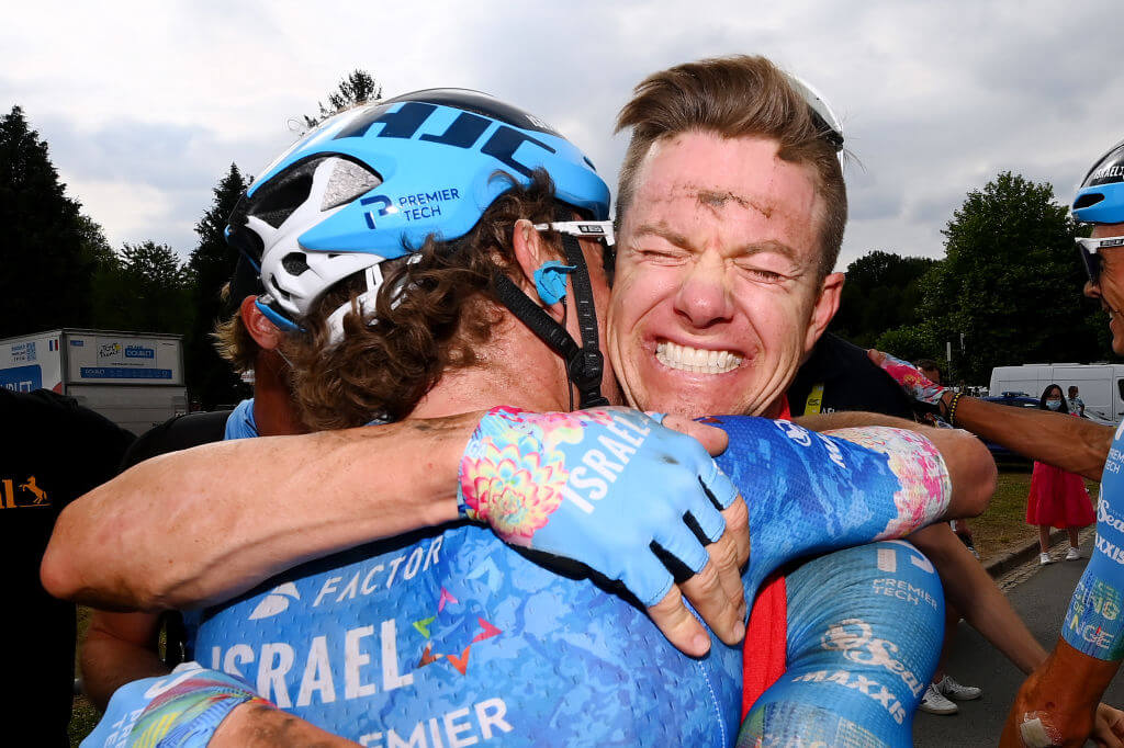 Michael Woods and Simon Clarke of Israel Premier Tech celebrate Clarke's stage win at the 109th Tour de France in 2022.