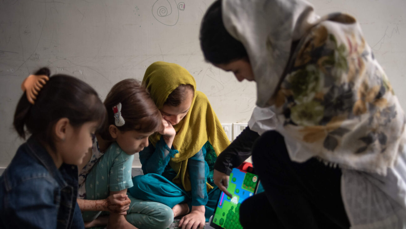 Children whose families fled Afghanistan after the fall of Kabul in 2021 take part in a robotics and electronics class at a guesthouse run by the Future Brilliance charity on April 28, 2023 in Islamabad, Pakistan. 