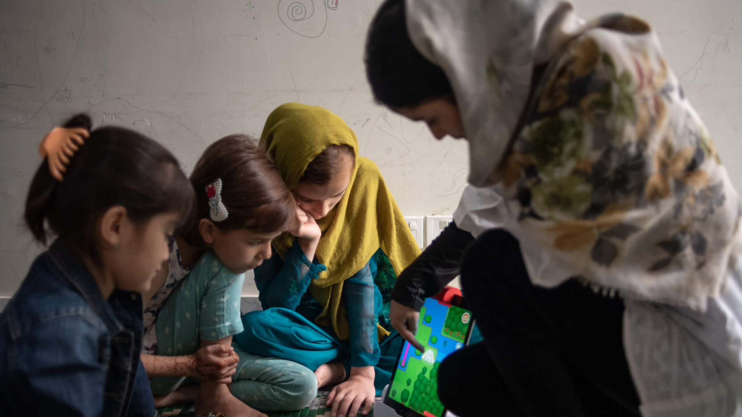 Children whose families fled Afghanistan after the fall of Kabul in 2021 take part in a robotics and electronics class at a guesthouse run by the Future Brilliance charity on April 28, 2023 in Islamabad, Pakistan. 