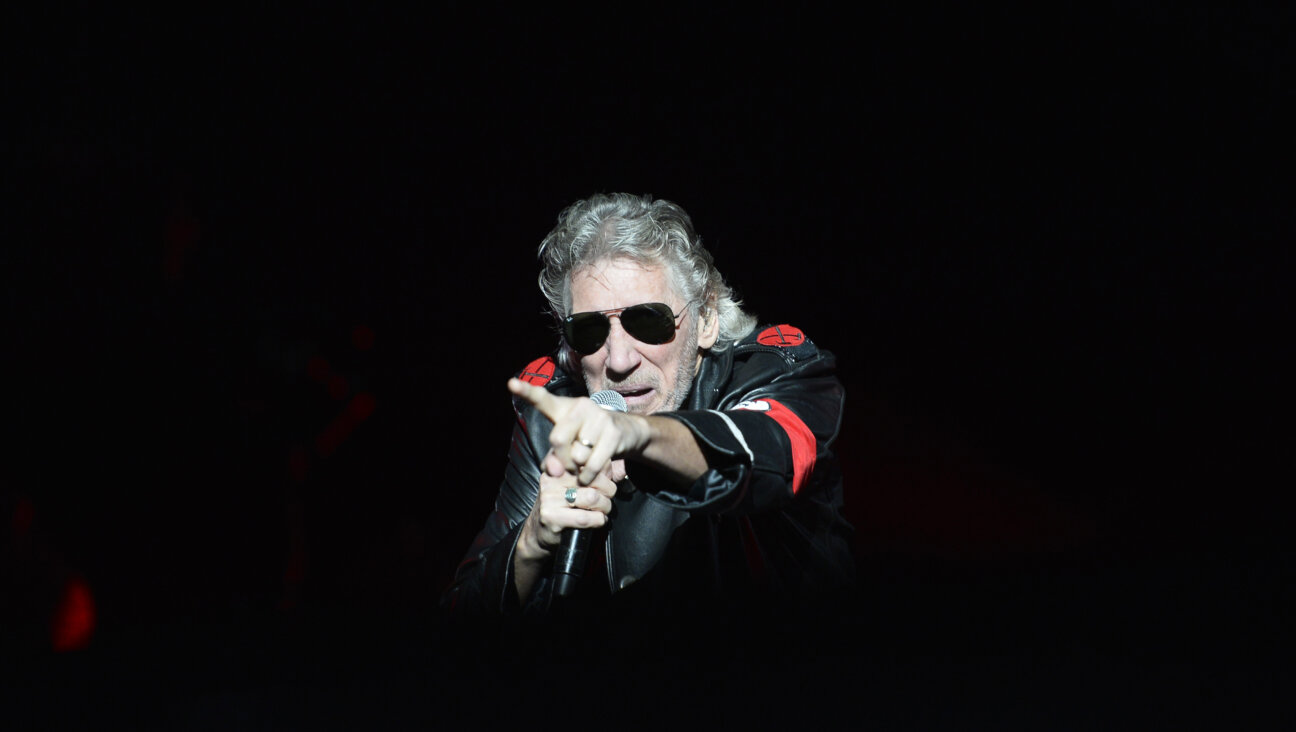Pink Floyd founding member Roger Waters onstage in Berlin in 2013. He's performed for years in the costume with the red armband resembling a Nazi uniform. 