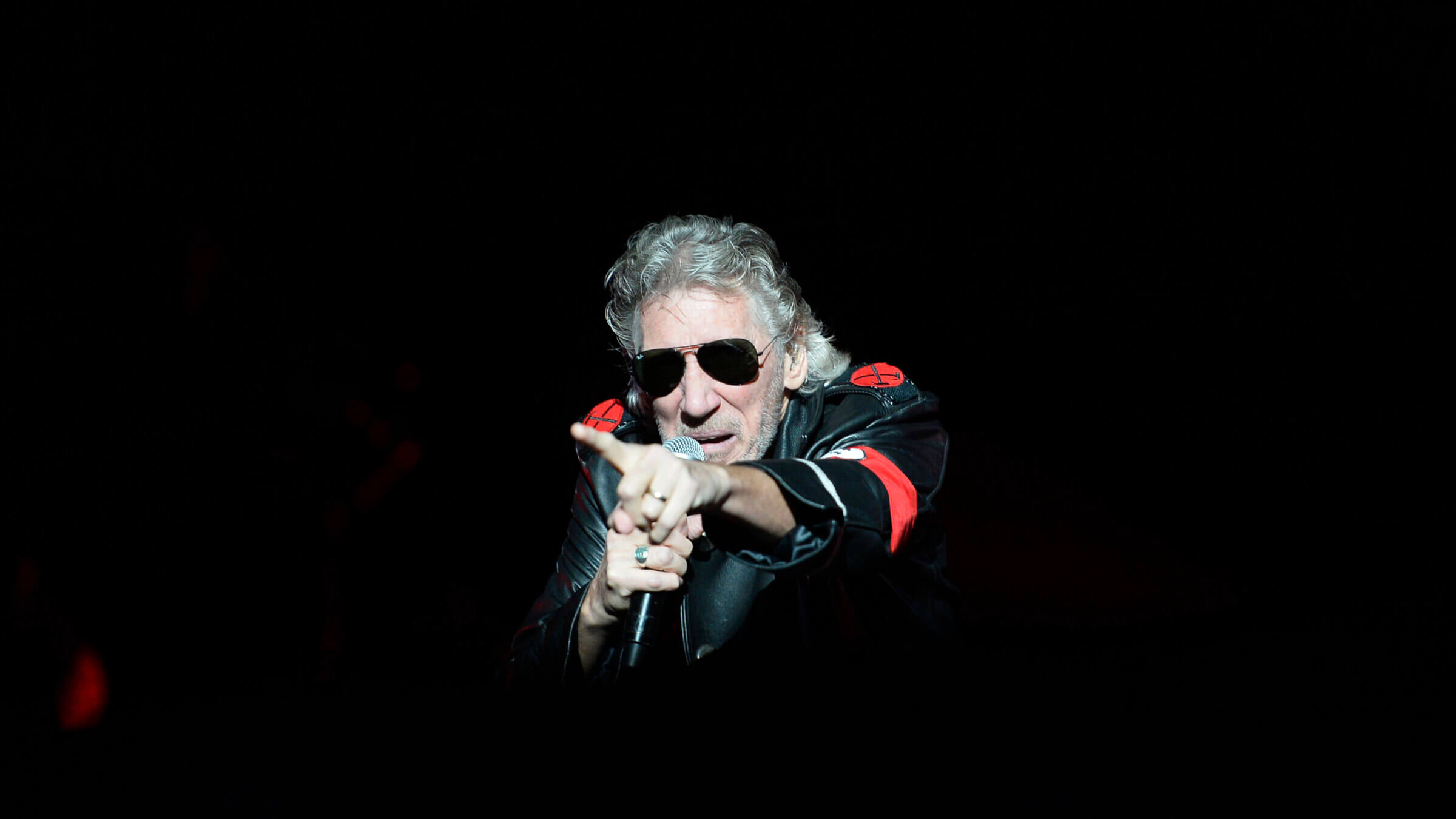 Pink Floyd founding member Roger Waters onstage in Berlin in 2013. He's performed for years in the costume with the red armband resembling a Nazi uniform. 