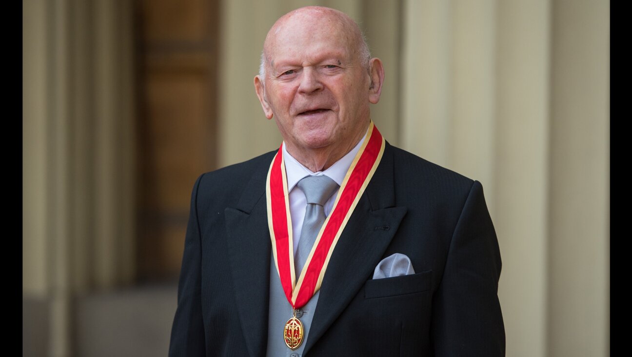 Ben Helfgott poses with his medal after being knighted at Buckingham Palace, Nov. 21, 2018.(Dominic Lipinski/AFP via Getty Images)