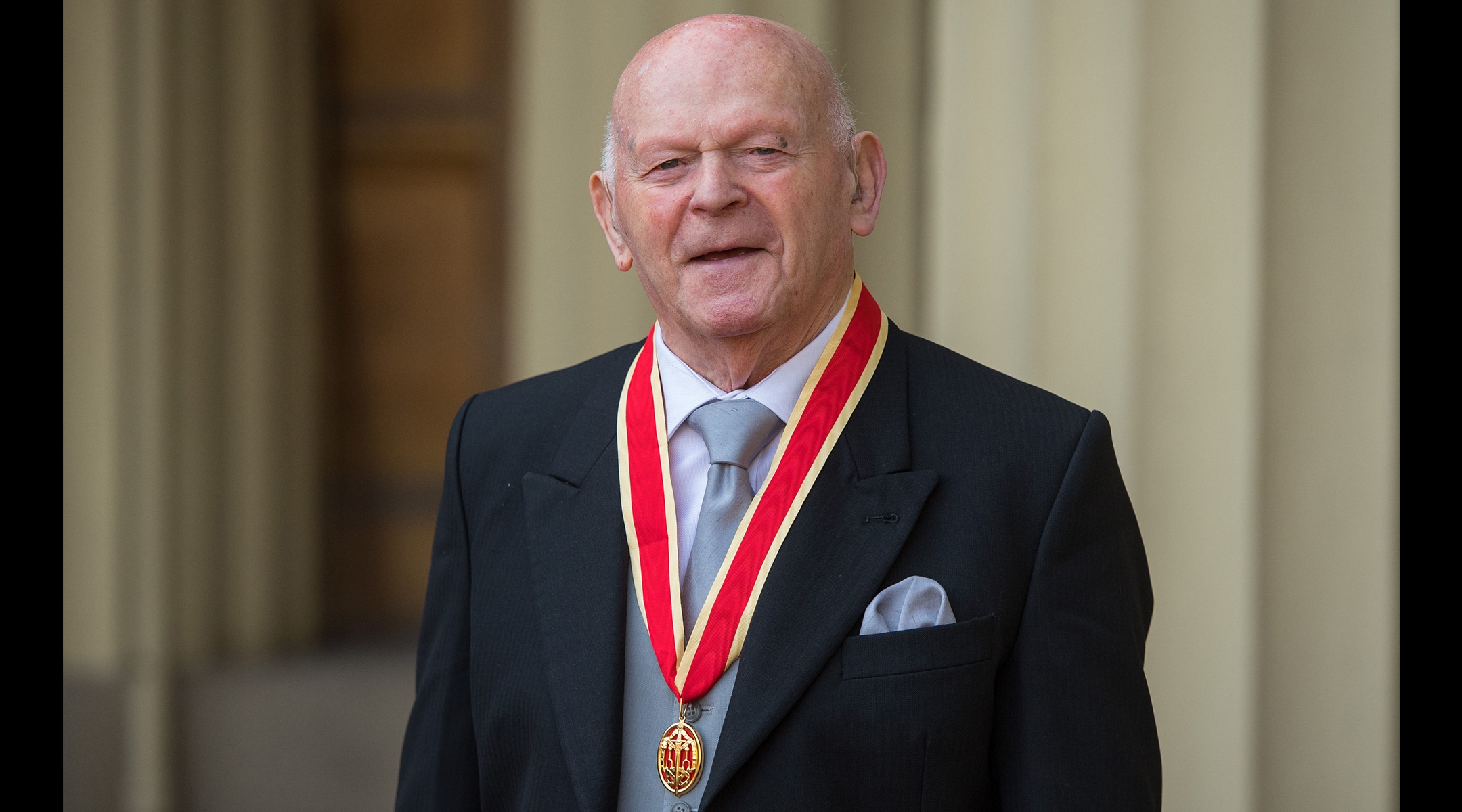 Ben Helfgott poses with his medal after being knighted at Buckingham Palace, Nov. 21, 2018.(Dominic Lipinski/AFP via Getty Images)