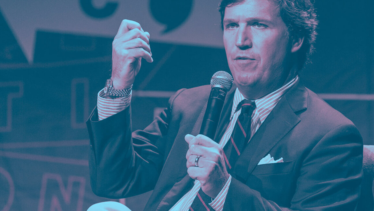 Background: Tucker Carlson speaks onstage during Politicon 2018 at Los Angeles Convention Center.