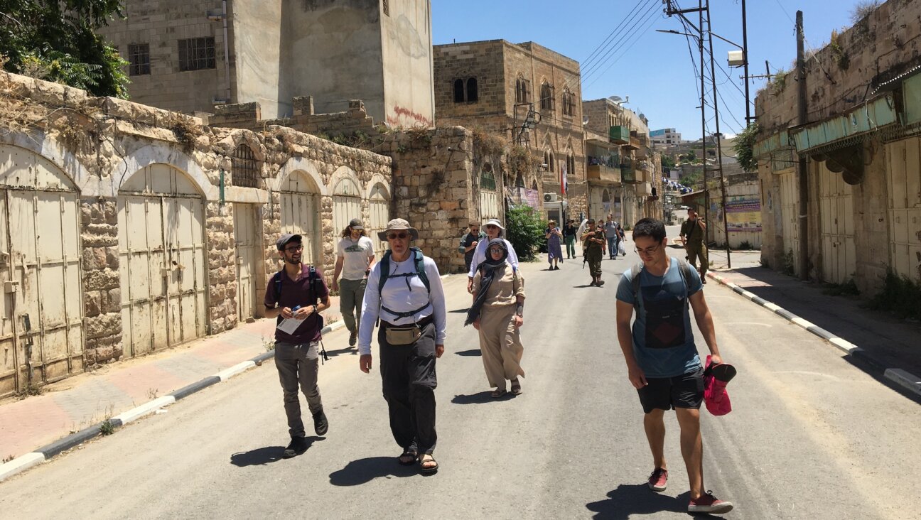 Participants on a recent tour of Israel and the West Bank, which included members of Pittsburgh’s Congregation Dor Hadash, walk through Hebron. (Courtesy of Shleimut)