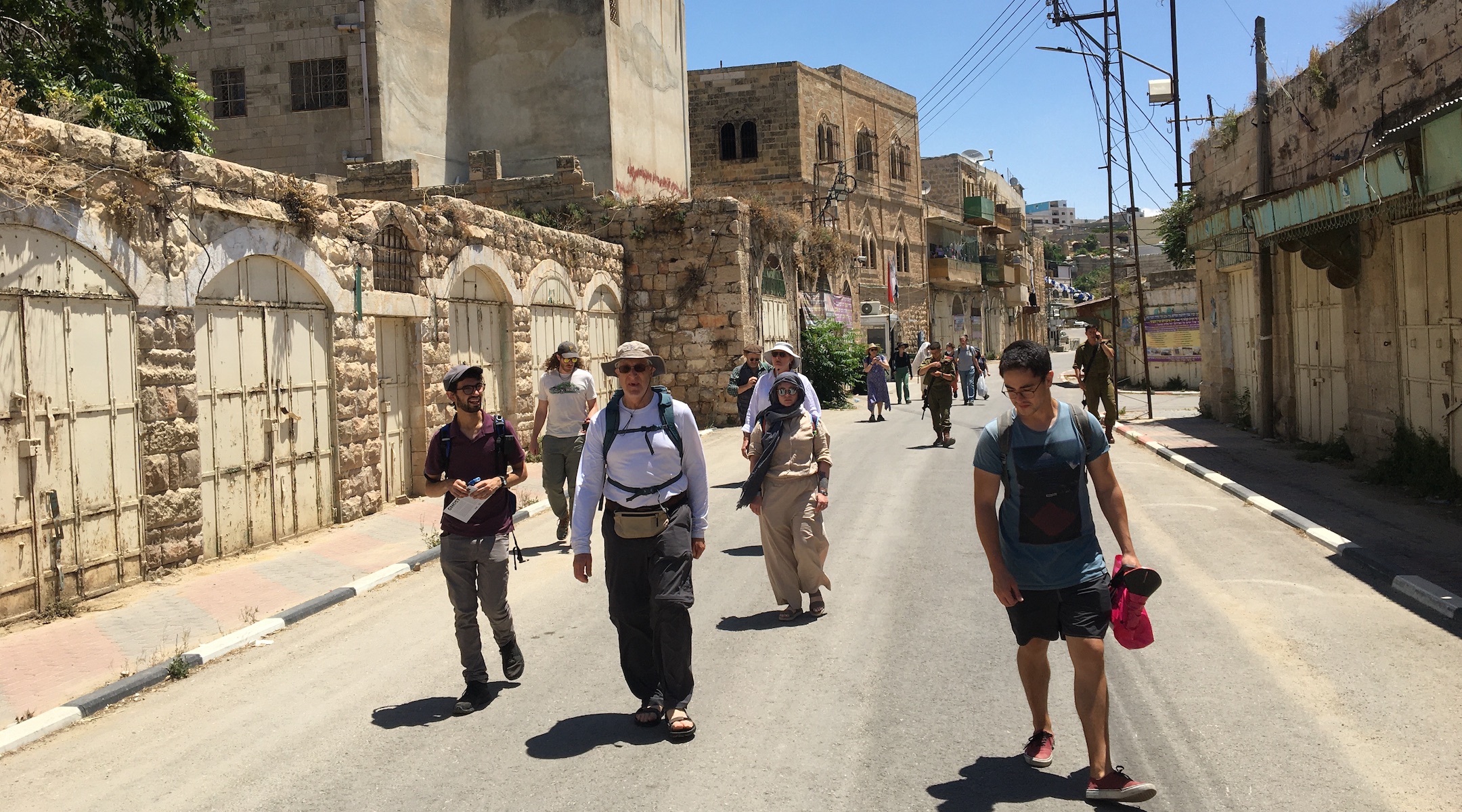 Participants on a recent tour of Israel and the West Bank, which included members of Pittsburgh’s Congregation Dor Hadash, walk through Hebron. (Courtesy of Shleimut)