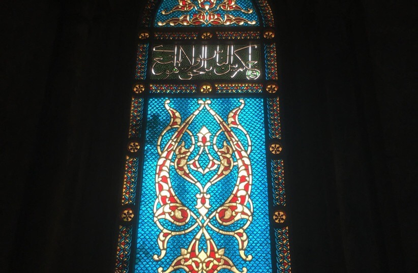 A stained glass window in the supposed room of the Last Supper.