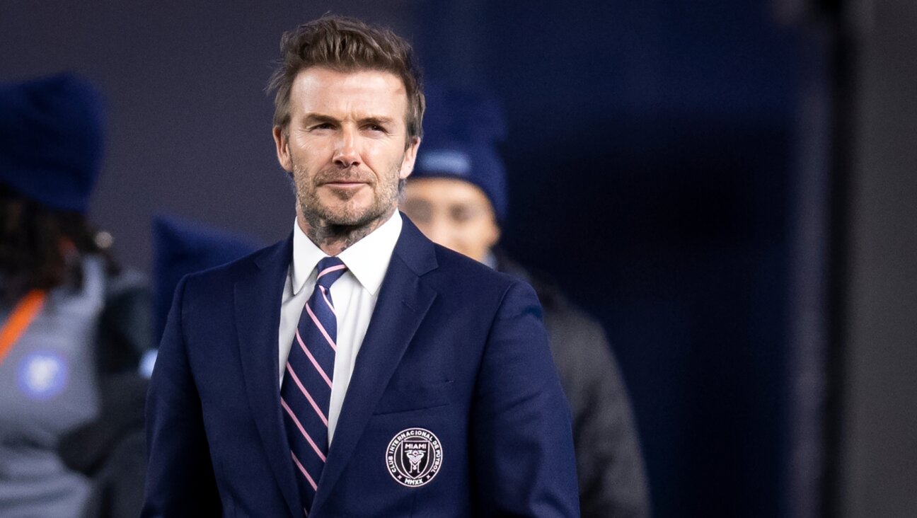 David Beckham, owner of Inter Miami CF, watches his team warm up ahead of a game. (Ira L. Black/Corbis via Getty Images)